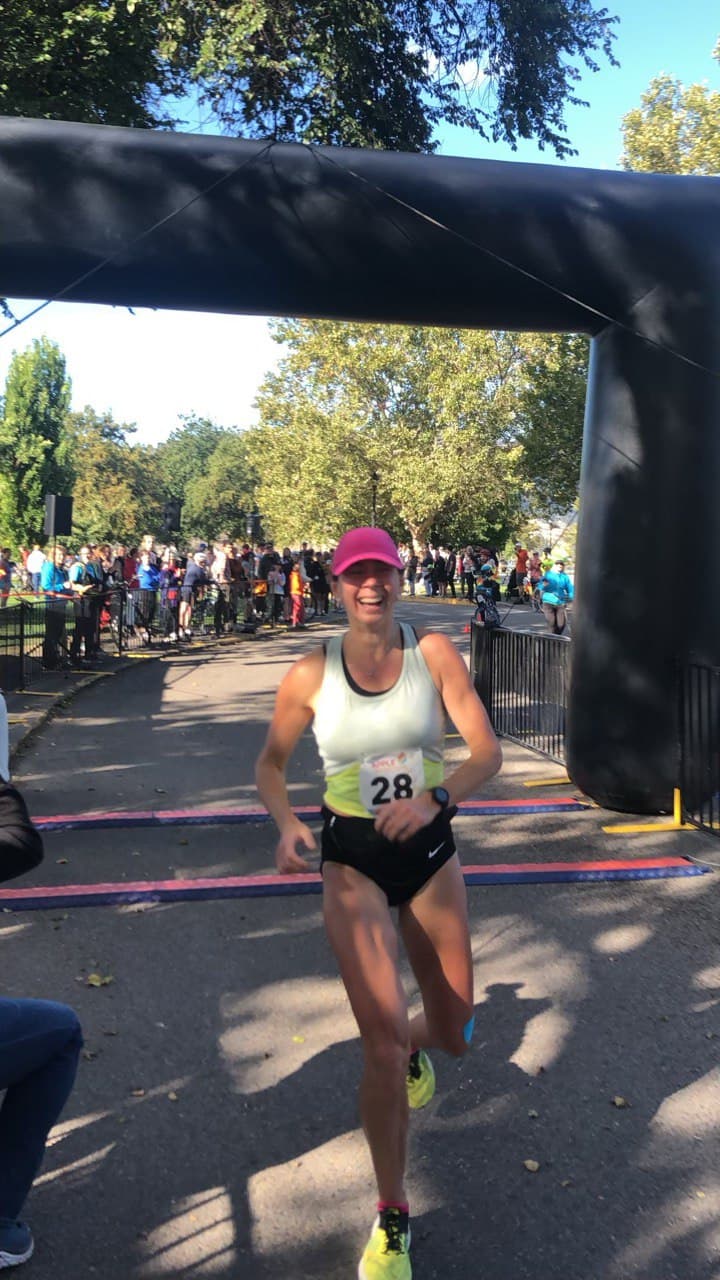 Stephanie Brown crossing the marathon finish line